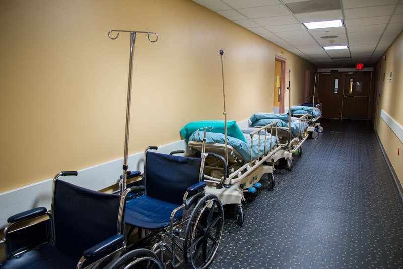 Gurneys and wheelchairs sit unused in a hallway at Mount St. Mary's Hospital in Niagara Falls, N.Y. The hospital is a non-profit that serves the area's aging and poorer populations.