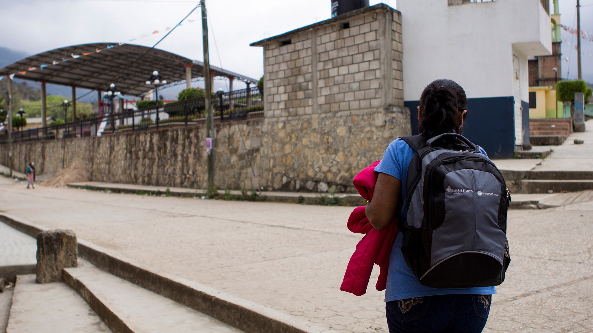 Maria López Mendoza, a health promoter for Marie Stopes International, walks through Bochil, one of the cities in Chiapas where she distributes contraceptives to midwives. Normally she will visit each midwife two to three times a month. (Photo by Alex Lancial.)
