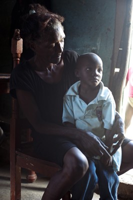 Victoria Hernandez holds her foster son, Rammon, who must take daily  antiretroviral drugs to treat his HIV.