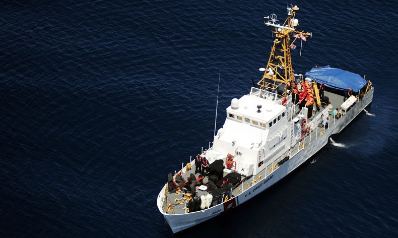 The U.S. Coast Guard cutter Chincoteague, seen here from a HH65-A Dauphin helicopter, interdicted a group of migrants the  night before as they tried to enter Puerto Rico on a vessel from the Dominican Republic. Although most of the migrants will be sent back to the Dominican Republic, the Coast Guard said at least five from the group would face prosecution in the U.S. Photo by Brandon Quester