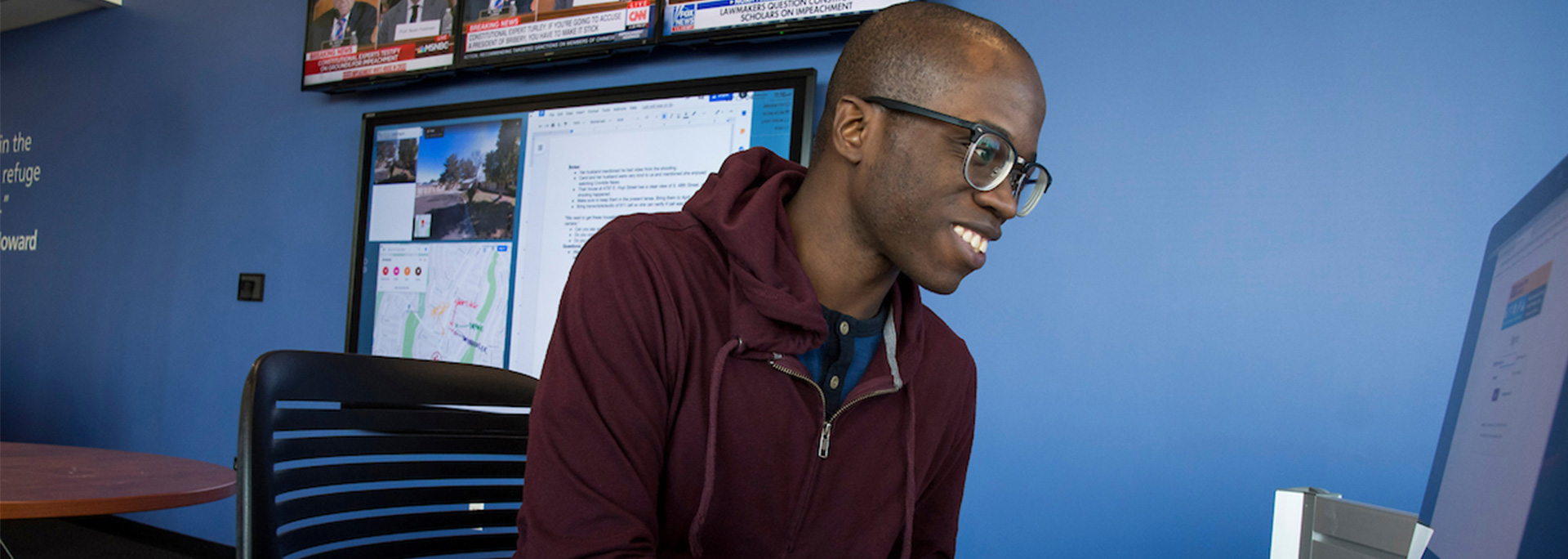 A Howard Center student works on his computer.