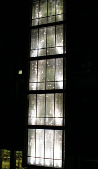exterior shot of stairwell windows at night