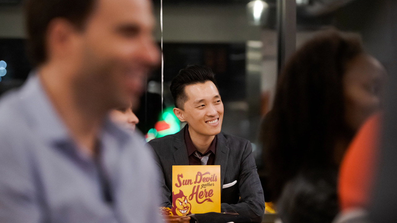 ASU alumni network at an event.