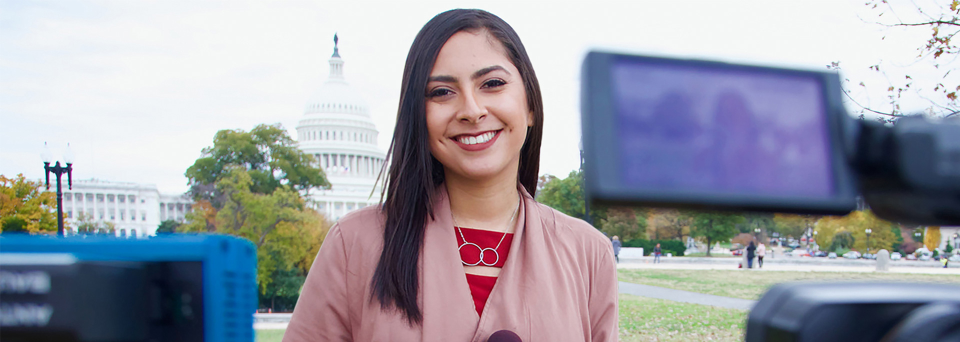 
		A Cronkite News student reports in front of the U.S. Capitol.		
