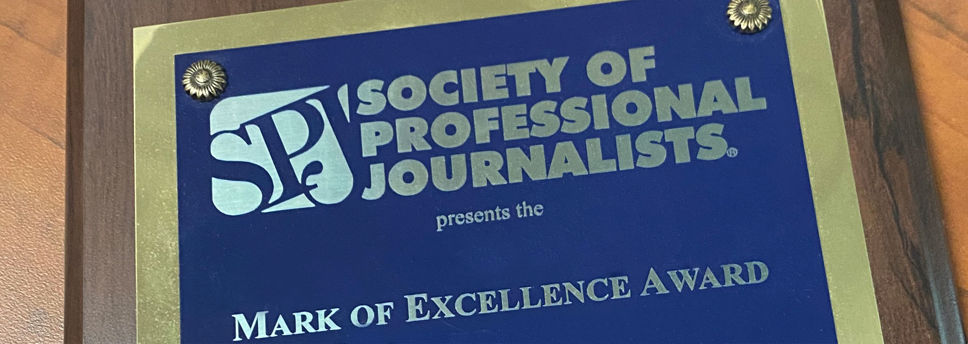 
		spj award, society of professional journalists, mark of excellence		