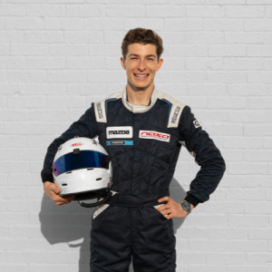 Student Joey Andrews holds his racing helmet.