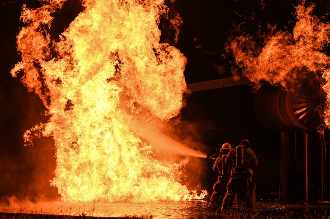 Air Force members battle a giant fire.