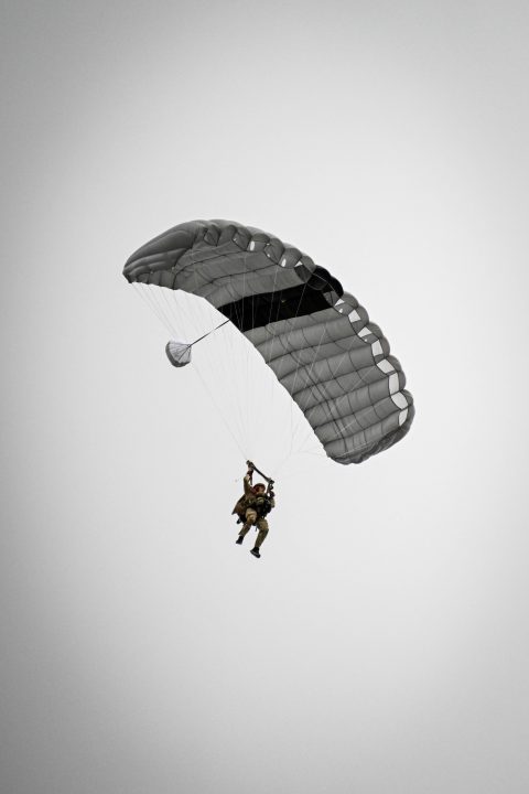 A member of the Air Force floats on a parachute.