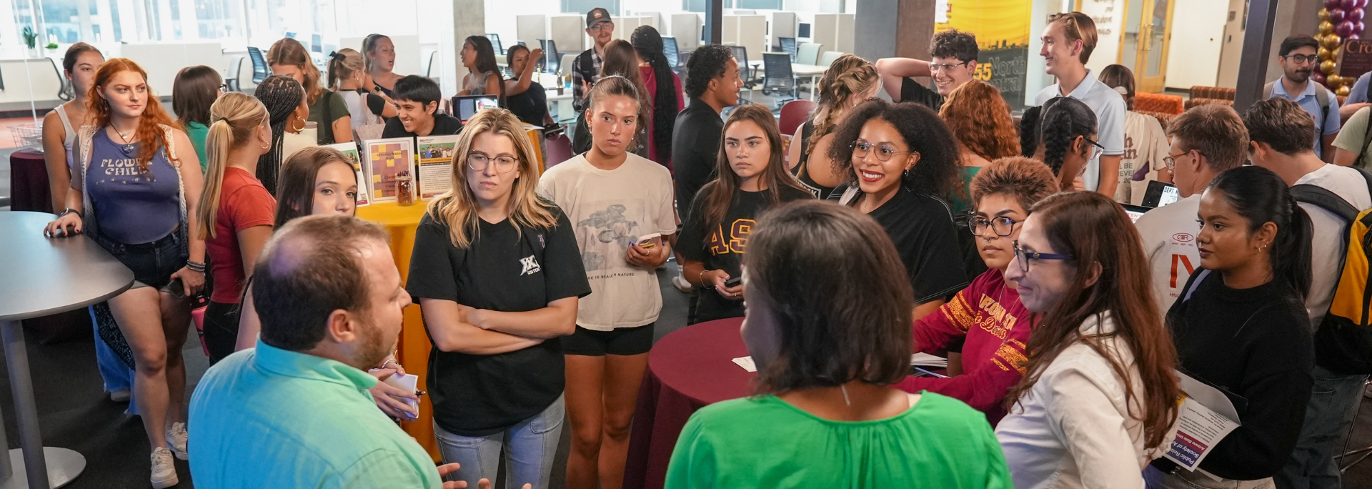 
		Group of students talking.		