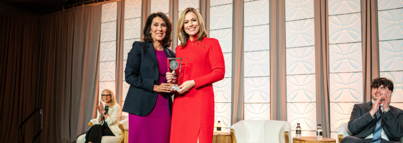 CNN anchor Pamela Brown accepting the Cronkite Award on behalf of Wolf Blitzer from ASU provost Nancy Gonzales